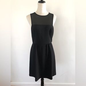 Very simple but elegant little black dress. Sheer on top.